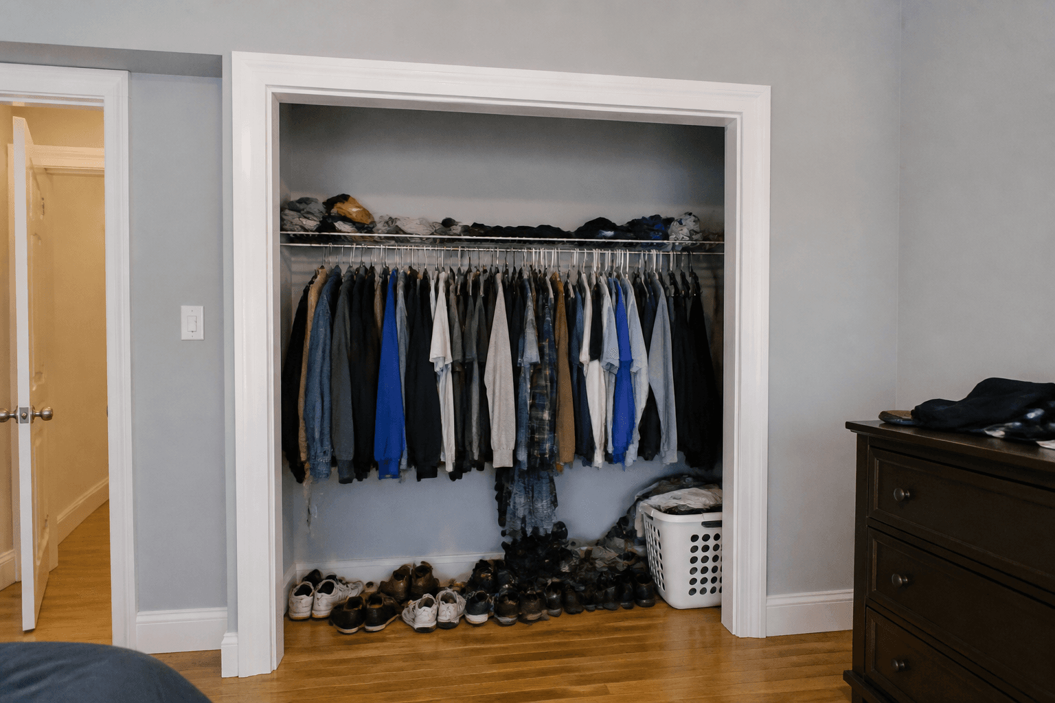 Cluttered closet before custom storage